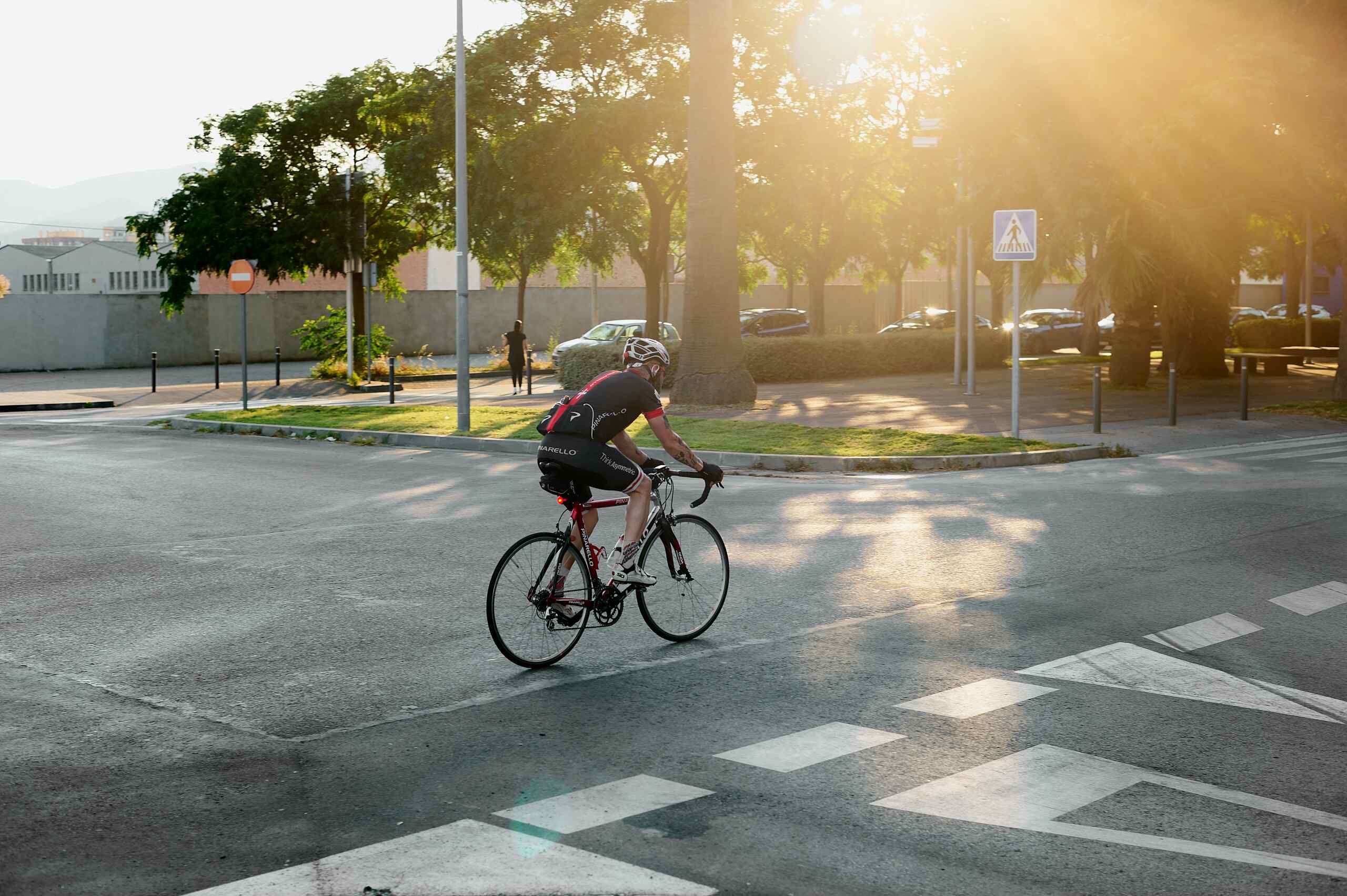 Cyclist riding through a road intersection while cycling on McMullen Booth Road in Safety Harbor.