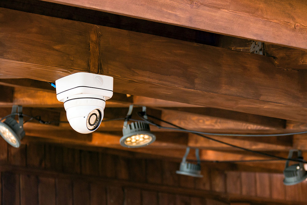 CCTV security camera monitoring a building interior to help prevent assaults and other violent incidents.