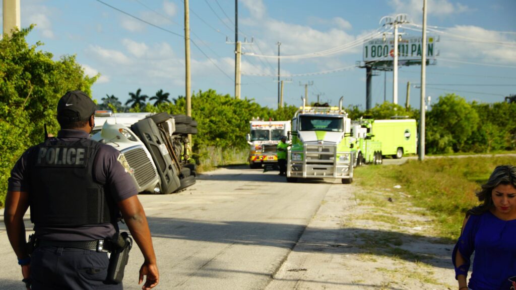 Clearwater crash scene with overturned truck and police response highlighting cases handled by a Clearwater motorcycle accident lawyer
