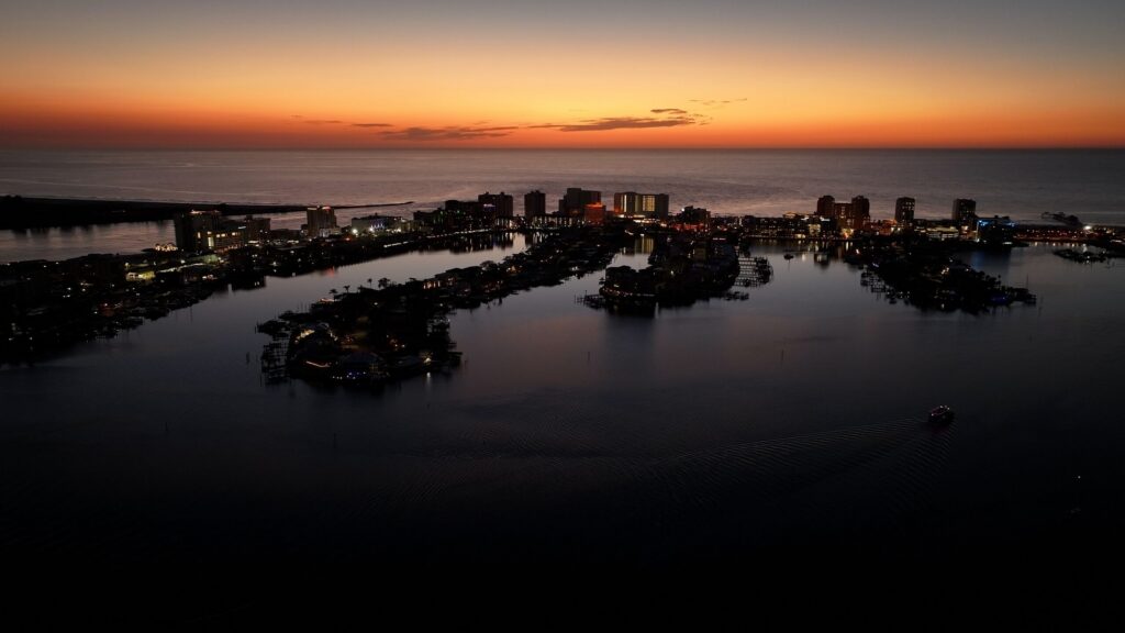 Aerial sunset view over the Clearwater Florida coastline and waterfront buildings.