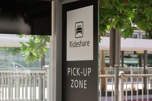 Rideshare pick-up zone sign at a designated area.