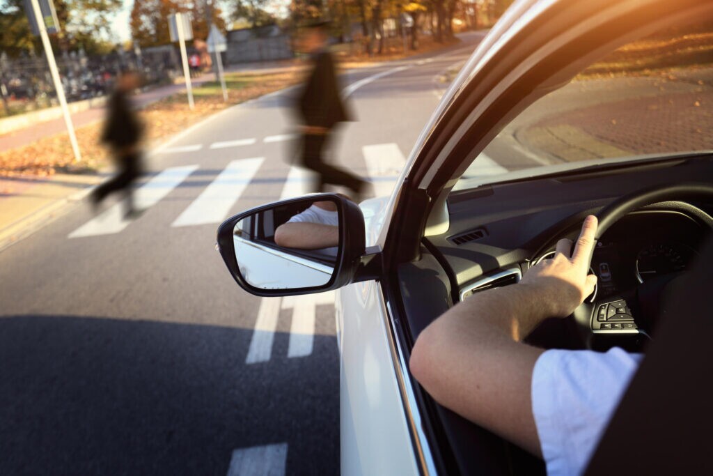 Clearwater pedestrian accident lawyer example of driver approaching crosswalk with pedestrians crossing road